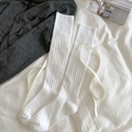 White JK style knee-high socks featuring vertical stripes and elegant silk ribbon bows - White