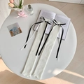 Jambières blanches en maille avec nœuds en ruban contrastés et texture côtelée - Taille unique / Blanc