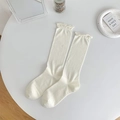 Creamy white cotton socks with lettuce edge cuffs and minimalist aesthetic flat lay - Ruffle Trim Without Bow / All White