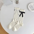 Creamy white rolled-edge crew socks with black ribbon bows for a sweet JK style - White Base Black Bow