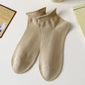 Minimalist khaki cotton ankle socks with ribbed cuffs shown on a clean warm background - Coffee