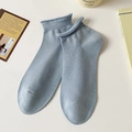 Light blue-grey cotton crew socks with ribbed rolled edges and a minimalist aesthetic - Blue