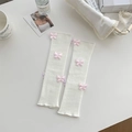 White knit balletcore leg warmers with cute pink 3D butterfly appliques and ruffled edges - One Size / White Base Pink Bow