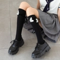 Black Lolita knee-high socks featuring white butterfly patches and silk ribbon bows - One Size / Black with White