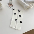 Beige ribbed knit leg warmers featuring cute 3D black and blue bowknot accents - One Size / White Base Black Bow
