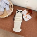 Jambières blanches en tricot avec nœud noir et design à ourlet à volants - Base Blanche Noeud Noir