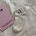 Beige confetti cotton socks with black bicycle embroidery in a minimalist setup - White with Cherries