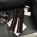Black knit leg warmers featuring silver side zippers and metallic triangle puller - One Size / Black
