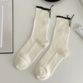 Cream white mid-calf socks with black ruffled edges and vertical knit stripes - One Size / White