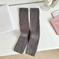 Dark gray knitted leg warmers with vertical ribbed texture for women in casual home setting - One Size / Gray