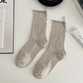 Minimalist oatmeal ribbed crew socks featuring grey ruffle trim and decorative ties - One Size / Khaki