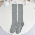 Light grey knee-high socks with ribbed cuffs in a Japanese school style minimalist design - One Size / Light Gray