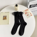 Calcetines altos negros estilo Lolita japonesa con ribete de encaje y textura de canalé - Negro