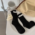Black ribbed knee high socks with white bow accents and delicate ruffled edge - One Size / Black