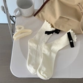 Milk white knit crew socks with ruffled edges and black velvet bow accent - One Size / White