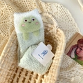 Cute green coral fleece socks with 3D frog design in a cozy woven storage basket - One Size / Green
