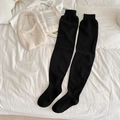 Thick black knitted over-knee socks for winter with ribbed cuffs on white fabric - One Size / Black