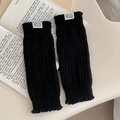 Black ribbed knit leg warmers with custom white label on vintage book background - Black (291 Black)