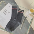 Dark grey ribbed mid-calf socks with pink stripes and minimalist fabric tag detail - One Size / Gray