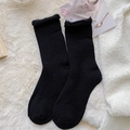 Black plush thermal socks for winter featuring fluffy cuffs and warm coral fleece texture - One Size / Black