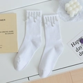 White crew socks with elegant pearl tassel fringe and ribbed cotton texture for women - One Size / White