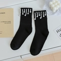 Elegant black mid-calf socks with white pearl tassel trim and ribbed cuff design - One Size / Black