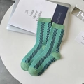Light green crew socks featuring black diagonal stripes and ribbed cuffs for a stylish look - Diagonal Stripe Style (M3112)