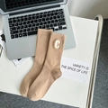 Mid-calf khaki ribbed cotton socks with letter C patch embroidery in a modern setup - One Size / Khaki