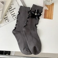 Dark grey ribbed crew socks featuring ruffle edges and black floral ornament decoration - Dark Grey / Ribbon Flower (23111 Grey)