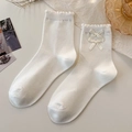 Sweet cream white lolita socks with ruffle trim and delicate ribbons in a vintage setup - One Size / Double Bow