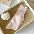 Minimalist light pink ribbed mid-calf socks presented on a white wooden tray - One Size / Pink