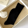 Minimalist black crew socks with vertical stripe texture in a cozy home setup - One Size / Black
