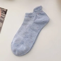 Light blue low cut boat socks with colorful confetti dots and ribbed cuff for women - One Size / Blue