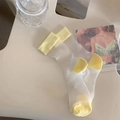 Sheer white mesh socks with bright yellow accents on a minimalist vintage chair - One Size / Yellow