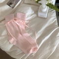 Sweet ballet style pink ribbed socks with satin bows in a cozy lifestyle setting - Pink