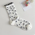White crew socks with black heart pattern and ruffled lettuce edges in sweet Japanese style - Black Heart
