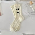 Cream white JK style slouch socks with black bows and knit cable pattern details - One Size / Beige