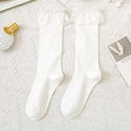 Sweet white knee high socks featuring delicate lace ruffles in a Japanese Lolita style - One Size / White