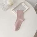 Pink knitted mid-calf cotton socks in minimalist style on a white aesthetic background - Nude Pink