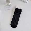 Sheer black mid-calf socks in ballet style with breathable ribbed texture and paper header - One Size / Black