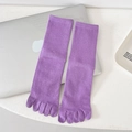 Solid purple mid-calf five-toe socks with ribbed cuffs on a white minimalist table - One Size / Purple