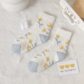 Calze spesse in pile corallo con motivo floreale blu e patchwork per il comfort invernale - Taglia unica / Motivo floreale