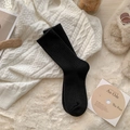 Calze spesse di lana nera da donna con texture a costine minimalista per il calore invernale - Taglia unica / Nero