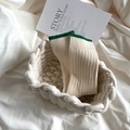 Retro cream-white mid-calf socks with green contrast trim in a minimalist basket - One Size / Green Cuff