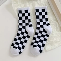 Checkerboard pattern crew socks in black and white knit with elastic ribbed cuffs - White Checkerboard