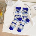 Sheer mesh socks in white with blue hearts and LOVE pattern with reinforced heel - One Size / Blue