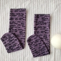 Purple mid-calf mesh socks with black graffiti print on a white textured background - Purple