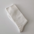 Classic pure white crew socks featuring a vertical ribbed knit design and cotton blend fabric - Coarse Striped Bleached White