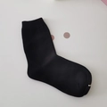 Classic black cotton crew socks with ribbed cuffs and golden packaging clip accessory - Solid Black