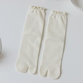 Creamy white Tabi socks with ruffled edges and ribbed texture in a minimalist Japanese style - One Size / Cream